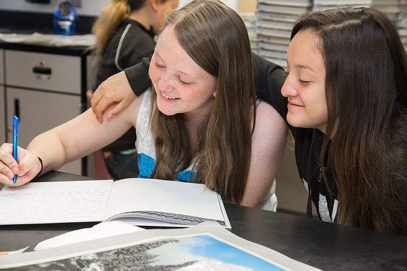 two girls studying